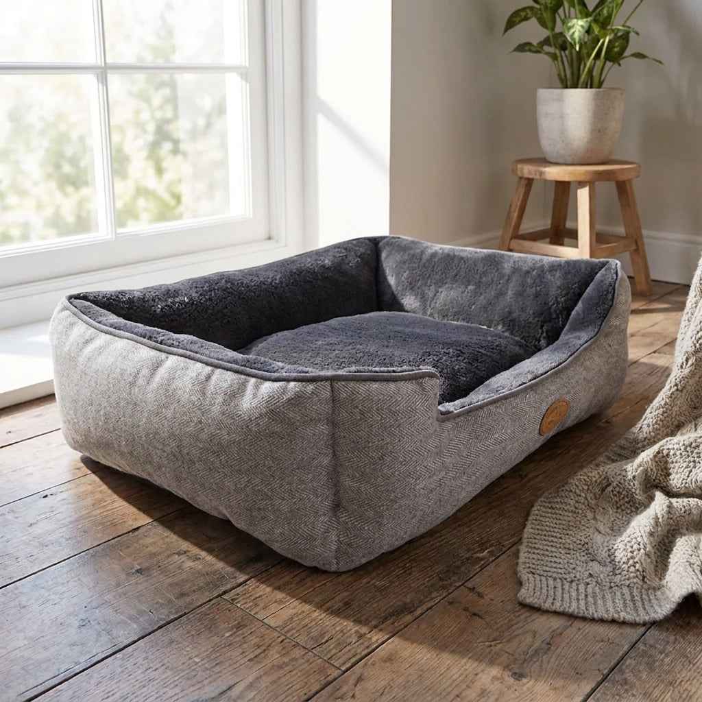 Plush pet bed with dark-gray inner cushion, light-gray fabric sides, low rectangular shape
