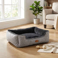 Plush pet bed with square front bolster and dark-gray inner pad in light-gray