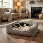 Square reversible fabric dog bed with plush liner and piped edge, dog resting.