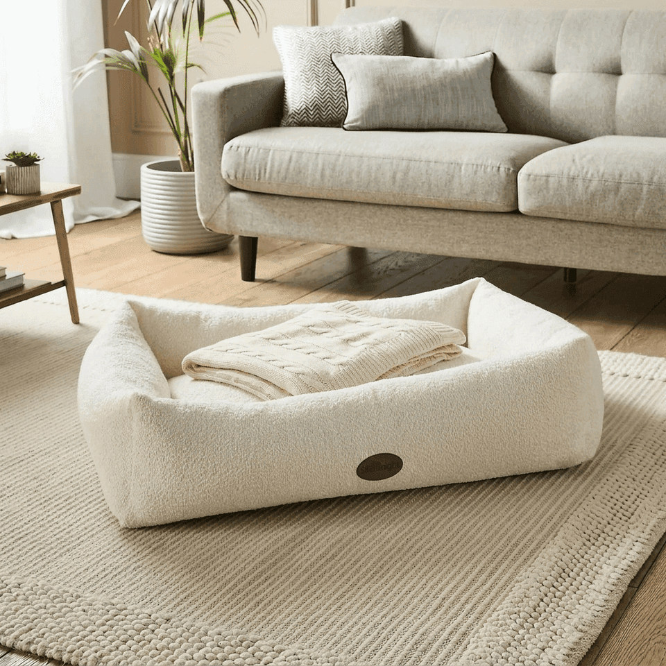 Cream boucle nest dog bed with raised rim - PawLunova Blea Tarn